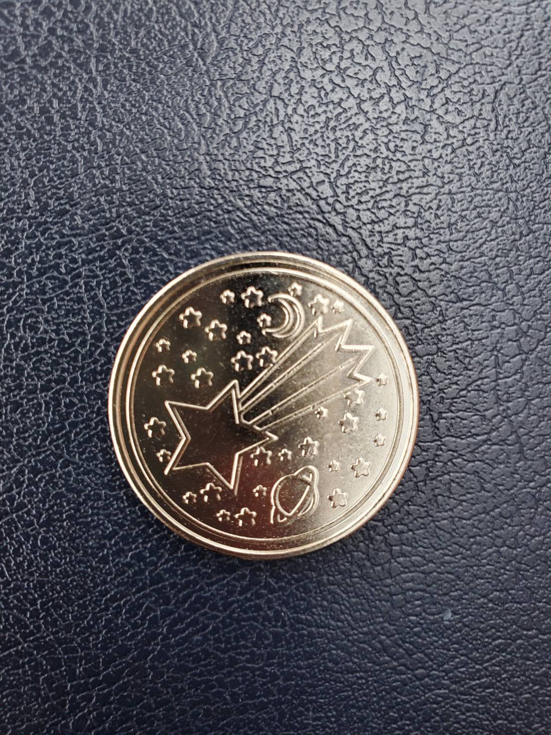 オリジナルデザインの専用コインの写真